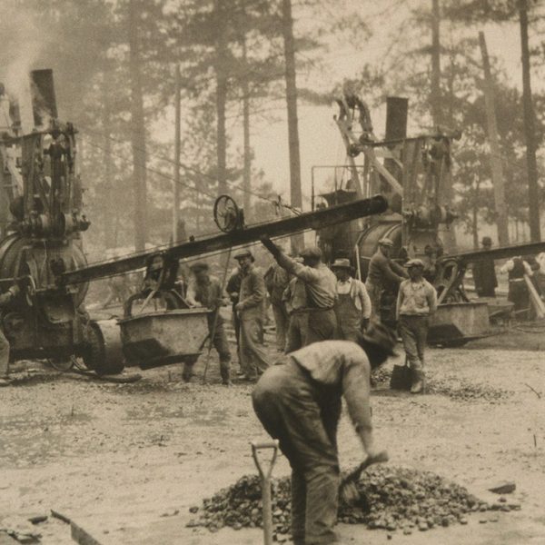 Early mobile concrete plants supply material for a new Toronto concrete road in 1925