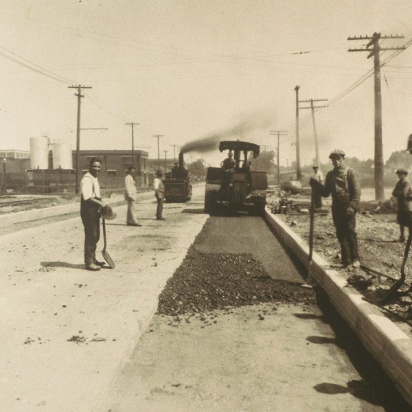 Warren Bitulithic crews put down black top surface on a dirt road Christina Street Sara 1929